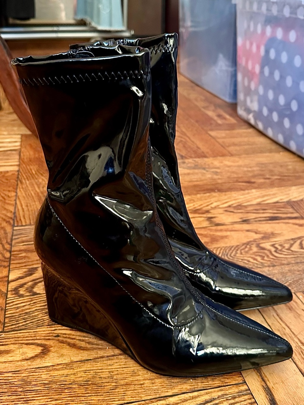 Black patent leather wedge boots with pointed toe and zipper 
Size 10